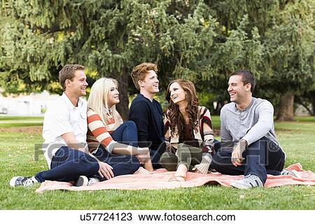 Group of friends in park View Large Photo Image Stock Image - Group of friends in park. Fotosearch
