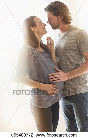 Happy man and his pregnant woman View Large Photo Image Stock Image - Happy man and his pregnant woman. Fotosearch