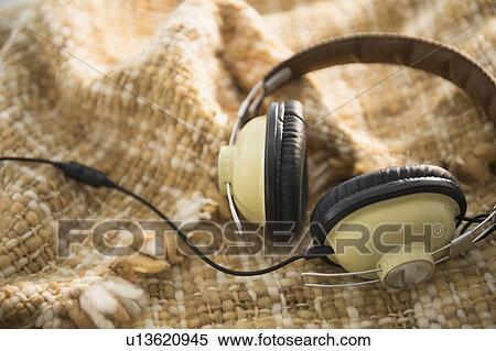 Stock Photography - Headphones on blanket. Fotosearch