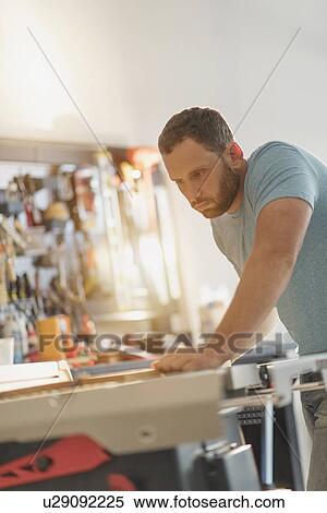 Man working in workshop View Large Photo Image Stock Photography - Man working in workshop. Fotosearch