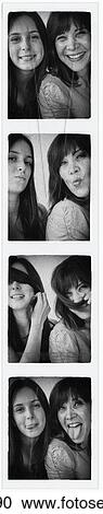 Stock Image - Photo booth picture of teenage girl (14-15) and her mom. Fotosearch