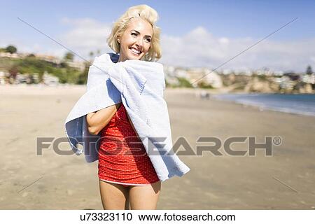 Portrait of blond woman on beach View Large Photo Image Stock Image - Portrait of blond woman on beach. Fotosearch