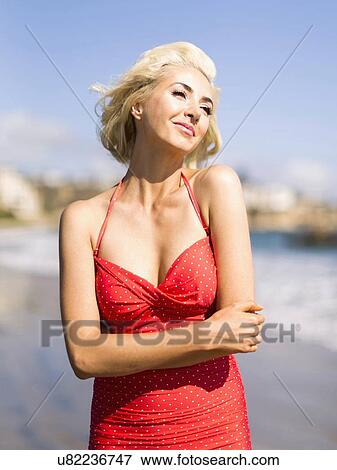 Portrait of blond woman on beach View Large Photo Image Stock Photo - Portrait of blond woman on beach. Fotosearch