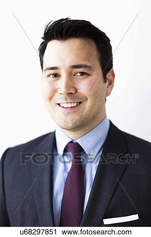 Stock Image - Portrait of businessman in suit. Fotosearch