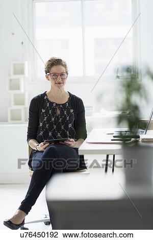 Portrait of businesswoman in office View Large Photo Image Stock Image - Portrait of businesswoman in office. Fotosearch