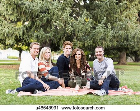 Portrait of friends in park View Large Photo Image Stock Image - Portrait of friends in park. Fotosearch