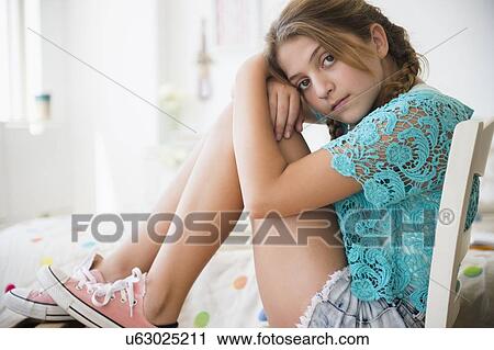 Portrait of girl (12-13) in bedroom View Large Photo Image Stock Image - Portrait of girl (12-13) in bedroom. Fotosearch
