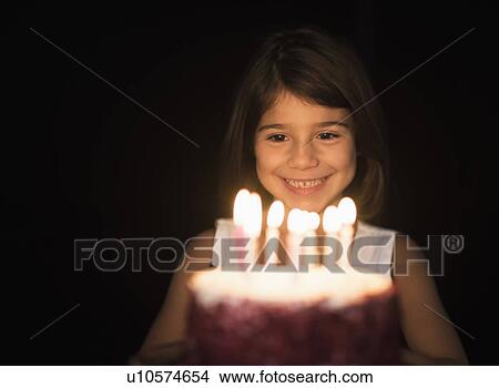 Picture - Portrait of girl (6-7) with birthday cake. Fotosearch
