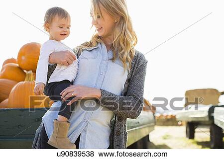 Portrait of mother and daughter (12-17 months) View Large Photo Image Stock Photo - Portrait of mother and daughter (12-17 months). Fotosearch