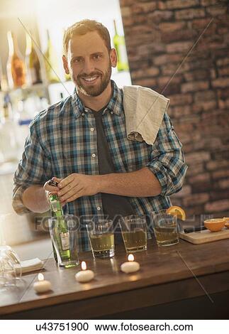 Portrait of smiling bartender View Large Photo Image Stock Image - Portrait of smiling bartender. Fotosearch