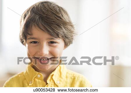 Stock Photo - Portrait of smiling boy (6-7) . Fotosearch