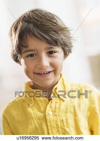 Stock Photography - Portrait of smiling boy (6-7) . Fotosearch