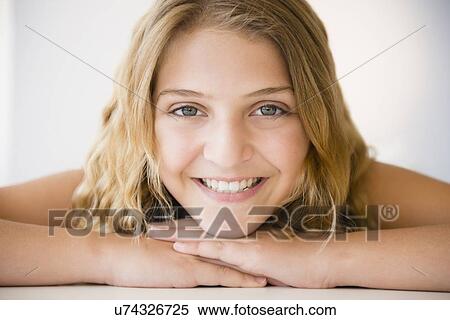 Stock Photography - Portrait of smiling girl (12-13). Fotosearch
