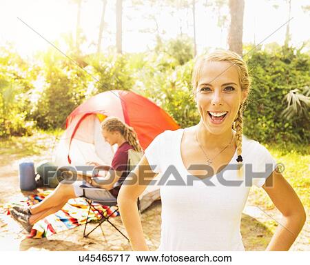 Portrait of smiling woman and man reading book View Large Photo Image Stock Photo - Portrait of smiling woman and man reading book. Fotosearch