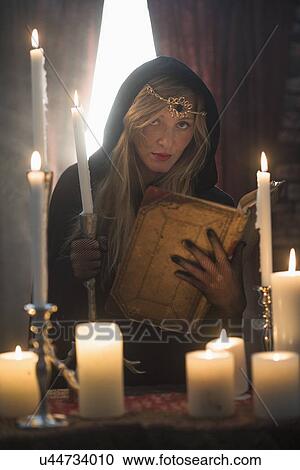 Portrait of sorceress in dark room View Large Photo Image Stock Image - Portrait of sorceress in dark room. Fotosearch