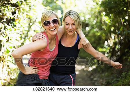 Portrait of two blond women in forest View Large Photo Image Stock Image - Portrait of two blond women in forest. Fotosearch