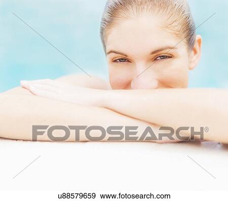 Portrait of woman on edge of swimming pool View Large Photo Image Stock Photo - Portrait of woman on edge of swimming pool. Fotosearch