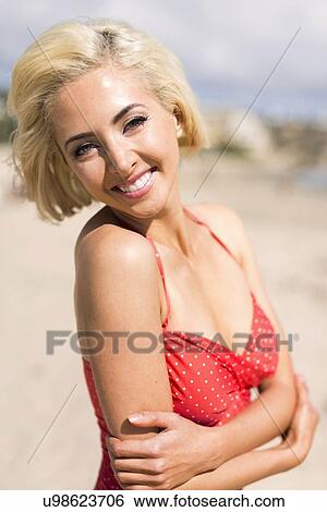 Portrait of woman wearing red swimsuit View Large Photo Image Stock Photograph - Portrait of woman wearing red swimsuit . Fotosearch