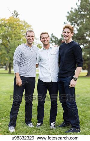 Portrait of young men in park View Large Photo Image Stock Photo - Portrait of young men in park. Fotosearch