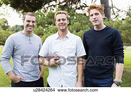 Portrait of young men with football View Large Photo Image Picture - Portrait of young men with football. Fotosearch