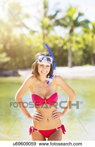 Portrait of young woman wearing bikini with snorkel and scuba mask on tropical beach View Large Photo Image Stock Photo - Portrait of young woman wearing bikini with snorkel and scuba mask on tropical beach. Fotosearch