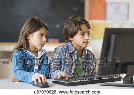 Pupils (6-7) using computer in classroom View Large Photo Image Stock Photograph - Pupils (6-7) using computer in classroom. Fotosearch
