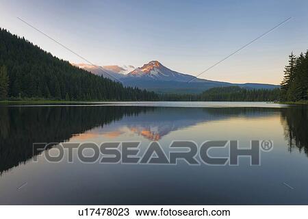 Reflection in still mountain lake View Large Photo Image Stock Image - Reflection in still mountain lake . Fotosearch