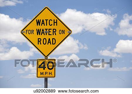 Road sign against cloudy sky View Large Photo Image Stock Photo - Road sign against cloudy sky. Fotosearch