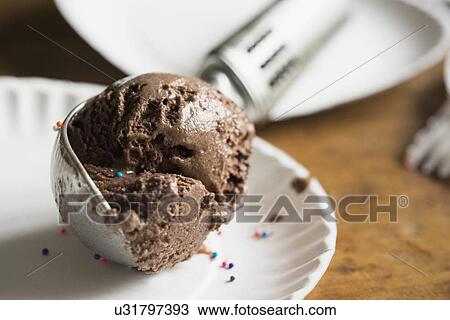 Stock Image - Scoop of chocolate ice cream. Fotosearch