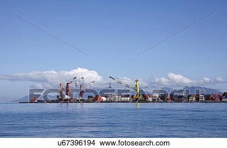 Skyline of container terminal seen from sea View Large Photo Image Picture - Skyline of container terminal seen from sea. Fotosearch