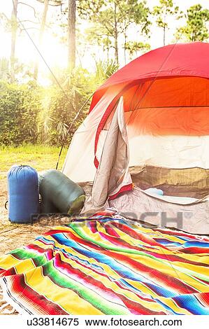 Stock Photography - Sleeping bags in front of tent. Fotosearch