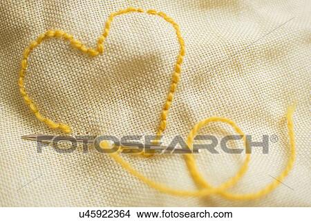 Stitched yellow heart View Large Photo Image Picture - Stitched yellow heart. Fotosearch