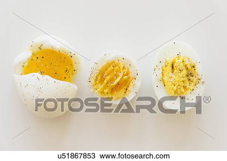 Stock Image - Studio shot cooked eggs with spices. Fotosearch