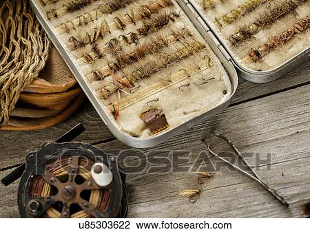 Stock Image - Studio shot of antique fly fishing set. Fotosearch