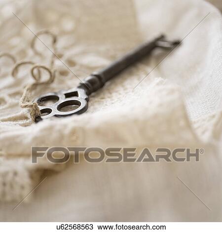 Studio shot of antique key on lace cloth View Large Photo Image Stock Image - Studio shot of antique key on lace cloth. Fotosearch