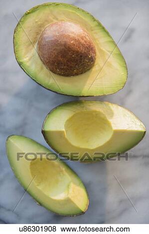 Stock Photo - Studio shot of avocado slices. Fotosearch
