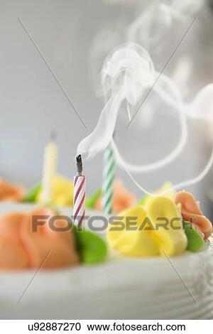 Studio shot of blown off candles on cake View Large Photo Image Stock Image - Studio shot of blown off candles on cake. Fotosearch