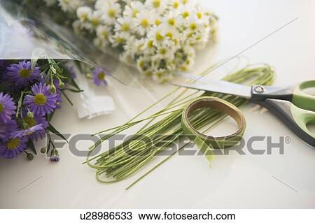 Stock Image - Studio shot of bouquets preparation. Fotosearch