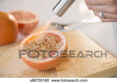 Studio shot of caramelizing sugar on grapefruit slice View Large Photo Image Stock Image - Studio shot of caramelizing sugar on grapefruit slice. Fotosearch
