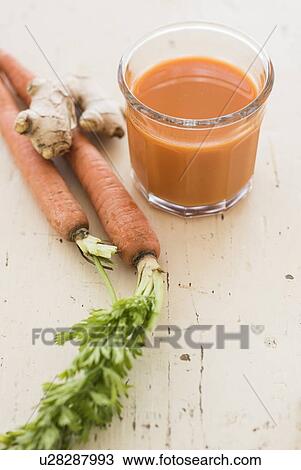 Stock Image - Studio shot of carrot juice. Fotosearch
