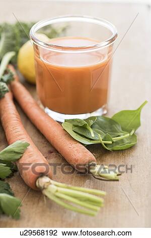 Stock Image - Studio shot of carrot juice. Fotosearch
