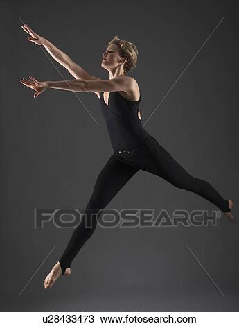 Stock Image - Studio shot of female ballet dancer. Fotosearch