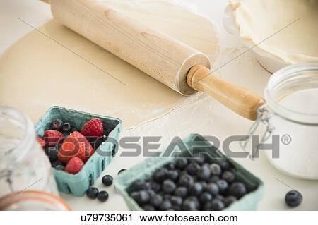 Stock Image - Studio shot of food fruit cake preparation. Fotosearch
