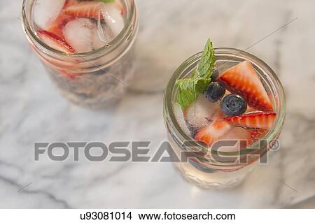 Picture - Studio shot of fruit cocktails. Fotosearch