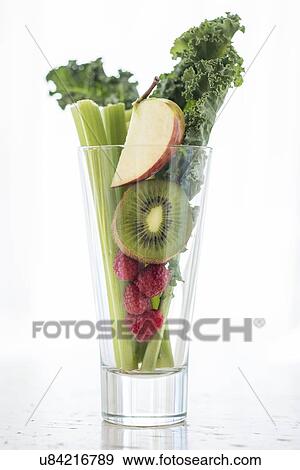 Studio shot of fruits and vegetables in glass View Large Photo Image Stock Photo - Studio shot of fruits and vegetables in glass. Fotosearch