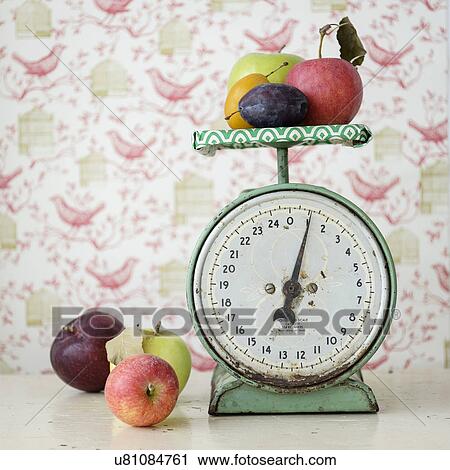 Studio shot of fruits on weight scale View Large Photo Image Stock Image - Studio shot of fruits on weight scale. Fotosearch