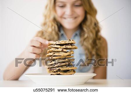 Studio shot of girl (12-13) with pancakes View Large Photo Image Stock Image - Studio shot of girl (12-13) with pancakes. Fotosearch