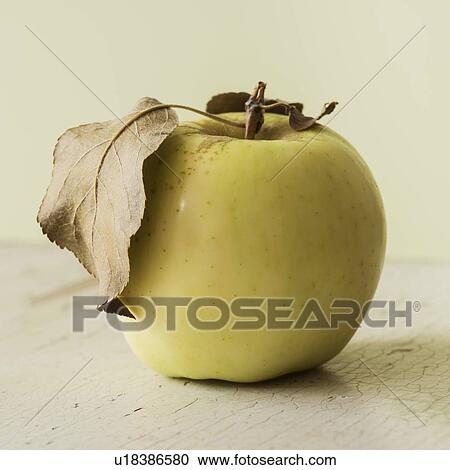 Stock Image - Studio shot of green apple. Fotosearch