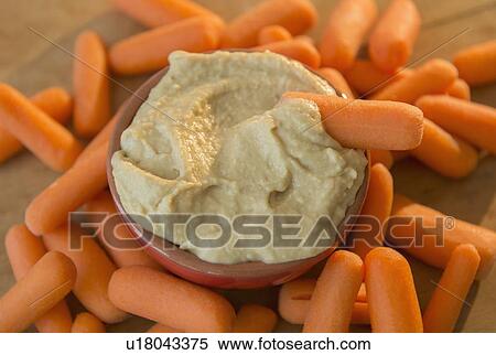 Studio shot of hummus and baby carrots View Large Photo Image Stock Photography - Studio shot of hummus and baby carrots. Fotosearch