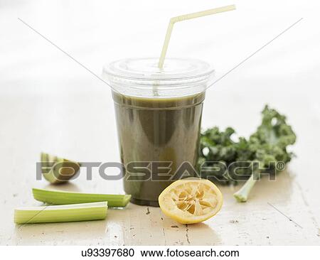 Stock Image - Studio shot of kale and celery juice. Fotosearch
